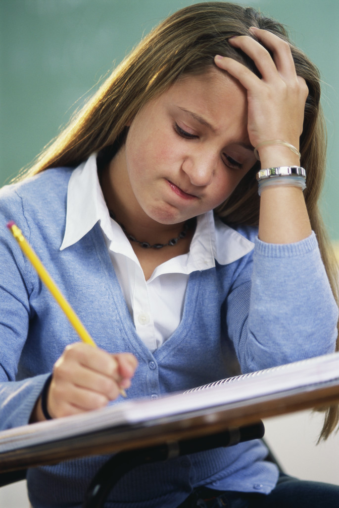 student using ACT study book student using ACT study book